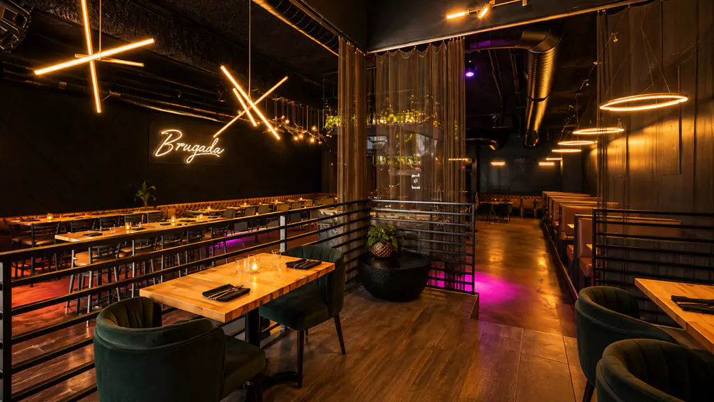 Brugada Kitchen & Bar dining room with the neon sign, seen from the raised lounge, downtown Nashville