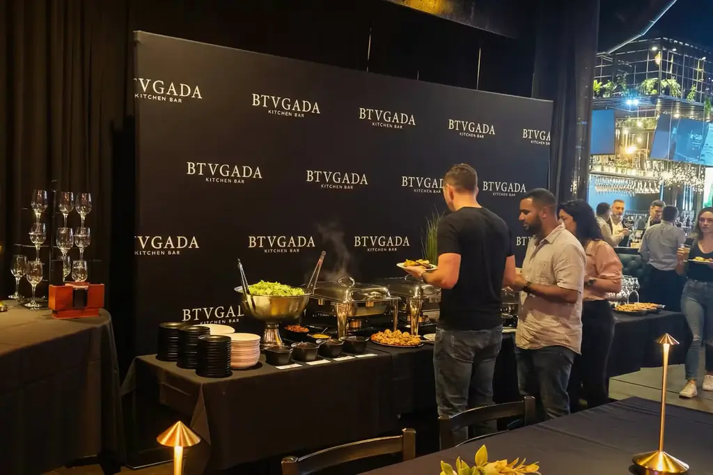 Private event buffet in front of the Brugada backdrop at Brugada Kitchen & Bar, downtown Nashville