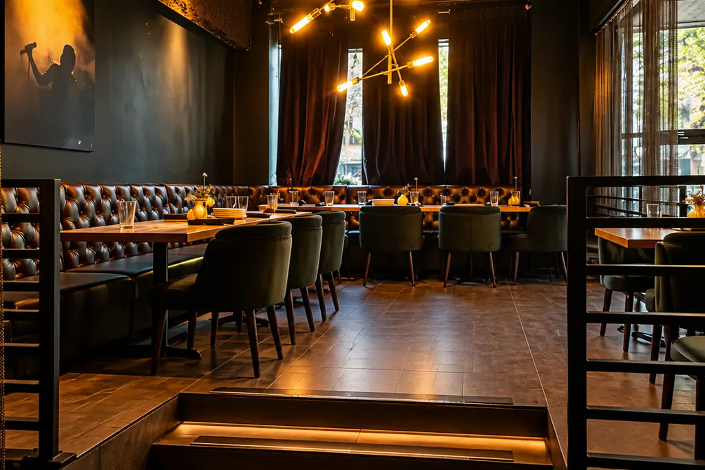 Singer's Lounge private dining room at Brugada Kitchen & Bar, downtown Nashville, with its lit stairs and leather banquette